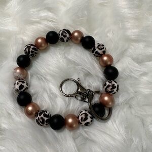 Rose gold cheetah wristlet